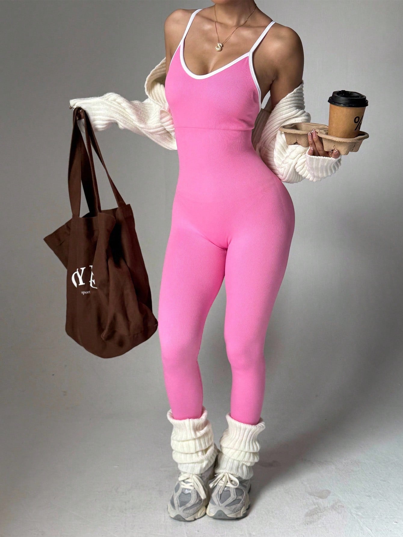 Elevate Your Yoga Game with the Slayoga Women's Ribbed Backless Jumpsuit in Pink
