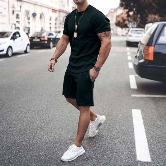 Men's casual sport suit for men black short sleeve t-shirt and shorts set with white sneakers on city street